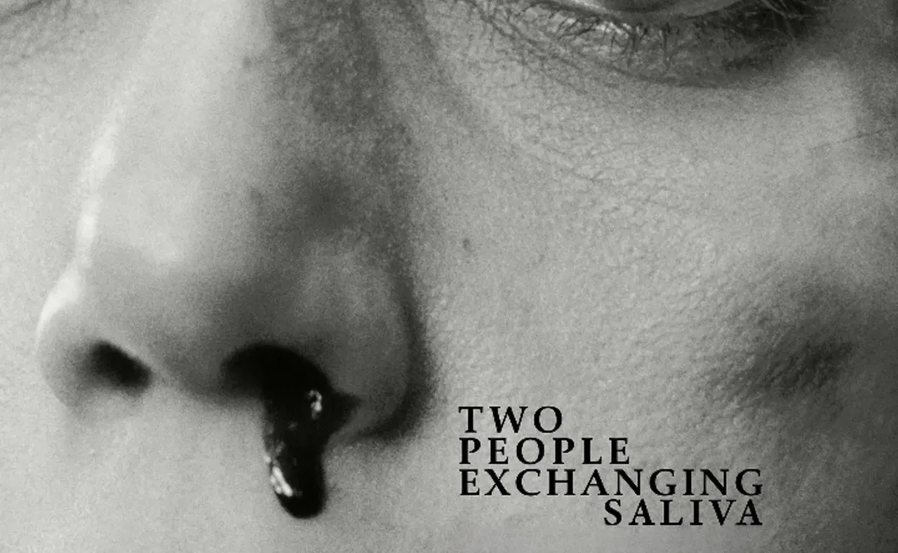 Two People Exchanging Saliva hero image